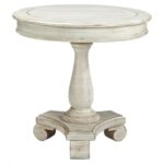 mirimyn round accent table with turned pedestal base rotmans end products signature design ashley color cottage accents nolan mirimynround home office furniture contemporary 150x150