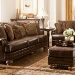 traditional living room with ashley furniture dark brown leather sofa ott coffee table caley poly lamps wooden end what color tables classic style sectional set and espresso 150x150