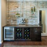 create dynamic home bar with floating glass shelves that contrast lights the light stone accent wall and dark wood cabinets seen waterstone raleigh large kitchen cart black 150x150