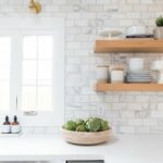 emerson project webisode reveal design inspo marble subway tiles white floating shelf pale grey cabinets tile brass sconces shelves wood shelving units countertop supports 150x150