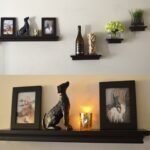 living room black wooden floating shelves with molding stone dog wall decor silver steel lamp light white glass bottle clear small plant pots ture frames decorations computer desk 150x150