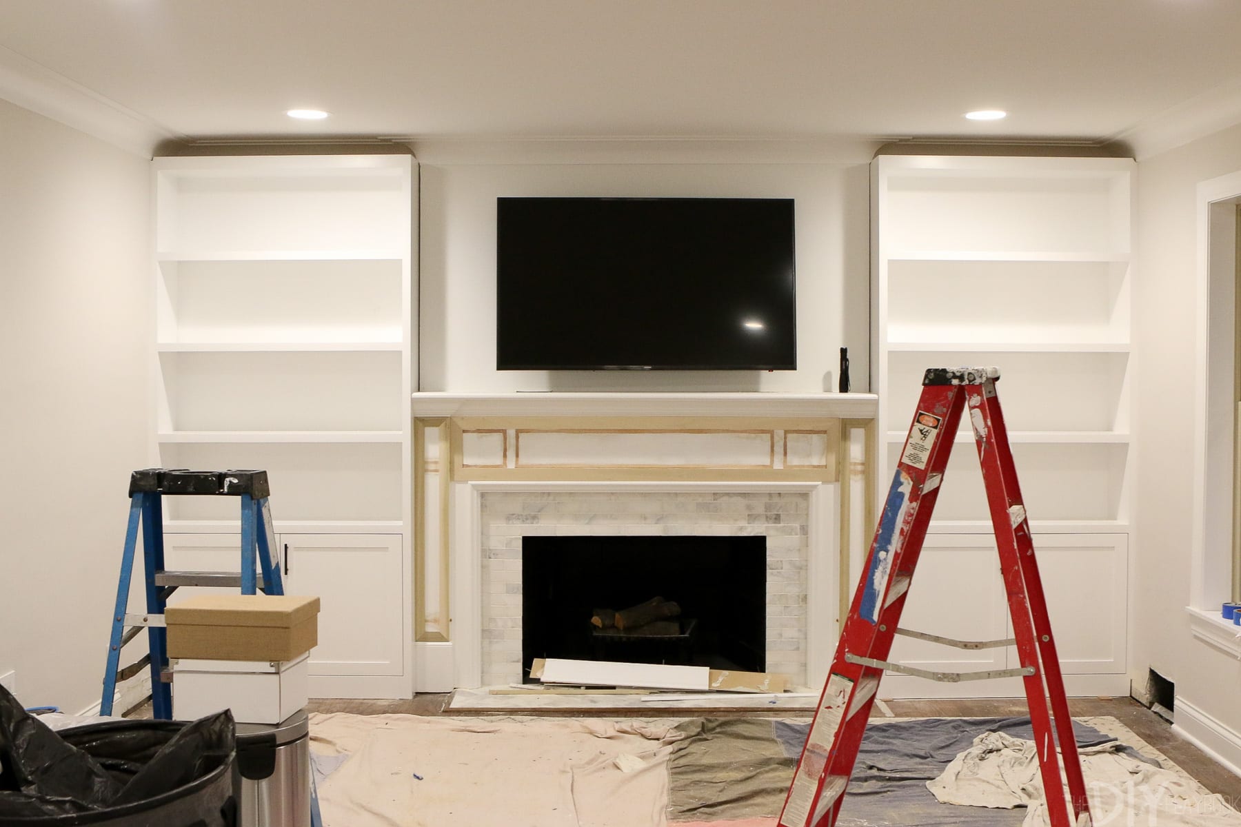 white built ins around the fireplace before and after diy catherine progress installing floating shelves flanking step process whte kitchen island table industrial tall mantel sei